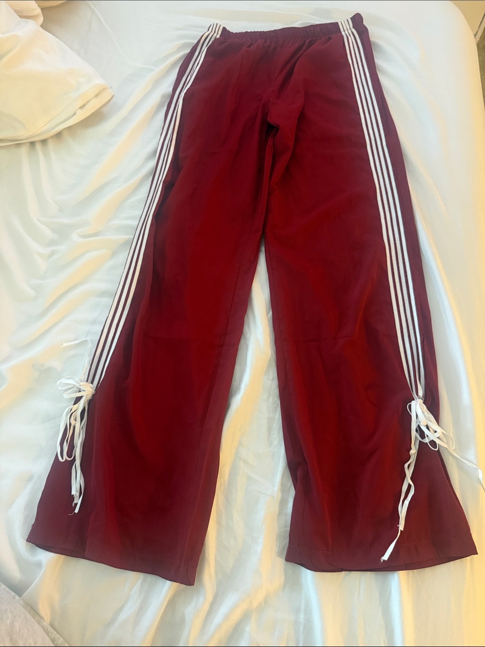 Burgundy Track Pants with White Side Stripes from Edikted